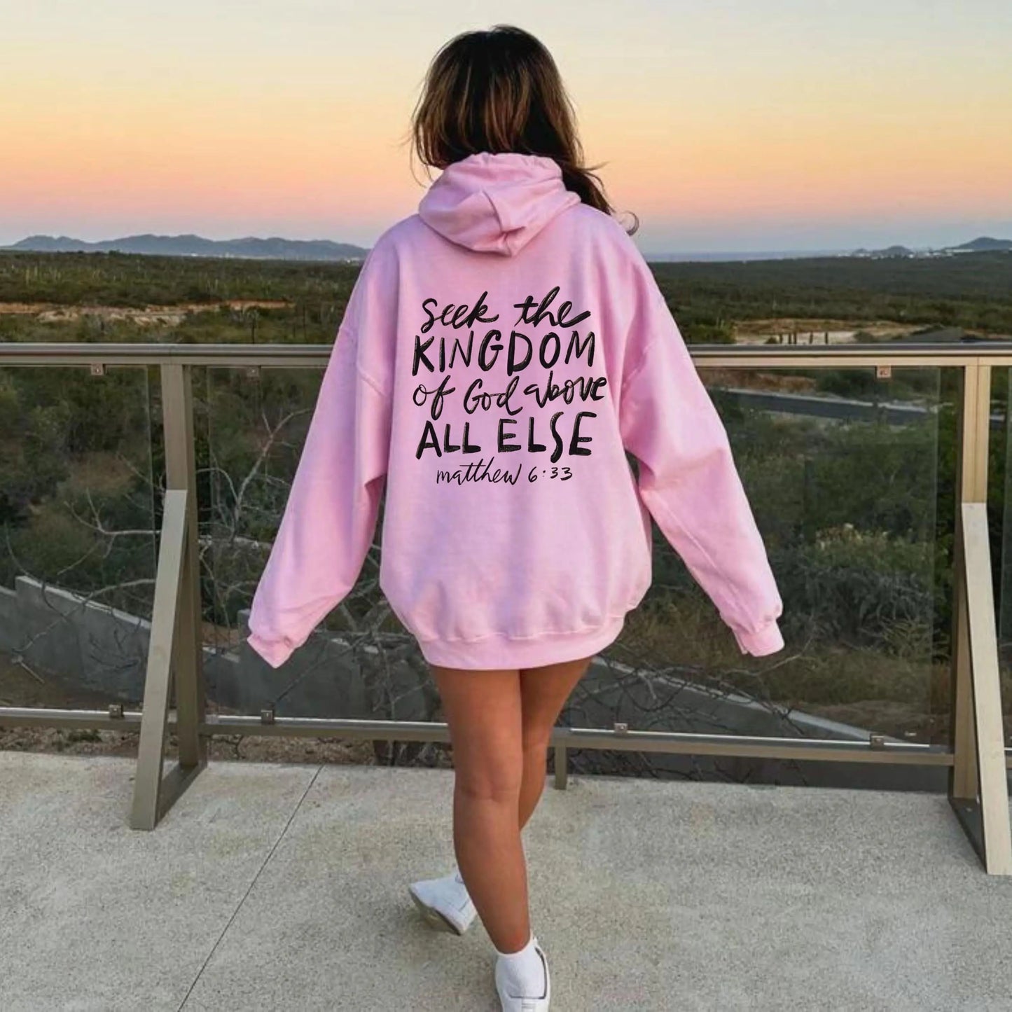 May include: Pink hoodie with a black graphic print that says "Seek the Kingdom of God above all else Matthew 6:33"