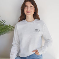 May include: A gray sweatshirt with the words &#39;JESUS KING&#39; printed on the front in black.