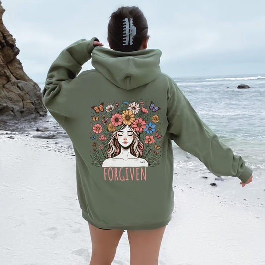 May include: Olive green oversized hoodie sweatshirt featuring a back graphic design of a woman with flowers in her hair and butterflies surrounding her. The word &#39;FORGIVEN&#39; is printed below the graphic. The hoodie has a drawstring hood and kangaroo pockets.